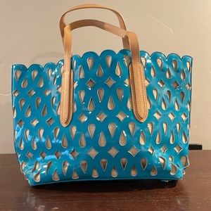 Beautiful turquoise leather bag with tan lining.Size 18 x 11. Fabric shows thru.